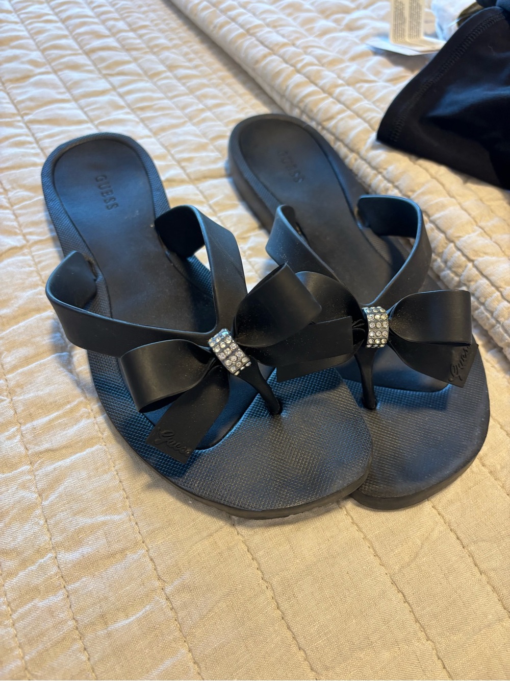 GUESS Black Bow Thong Sandals with Rhinestone Accent